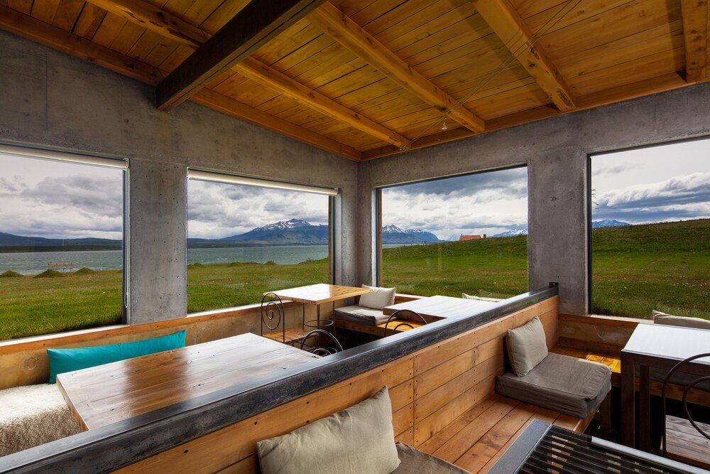 Modern interior with large windows at Altiplanico Puerto Natales