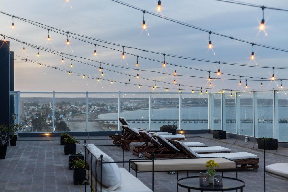 Rooftop terrace with lounge chairs at the hotel