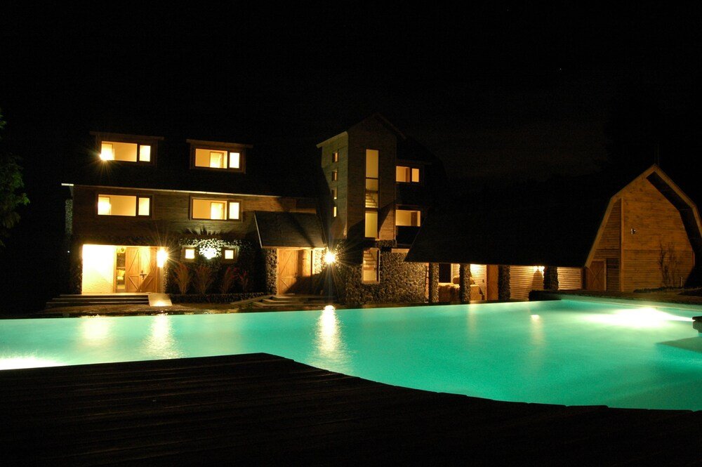 Modern hotel building with outdoor swimming pool in Pucón
